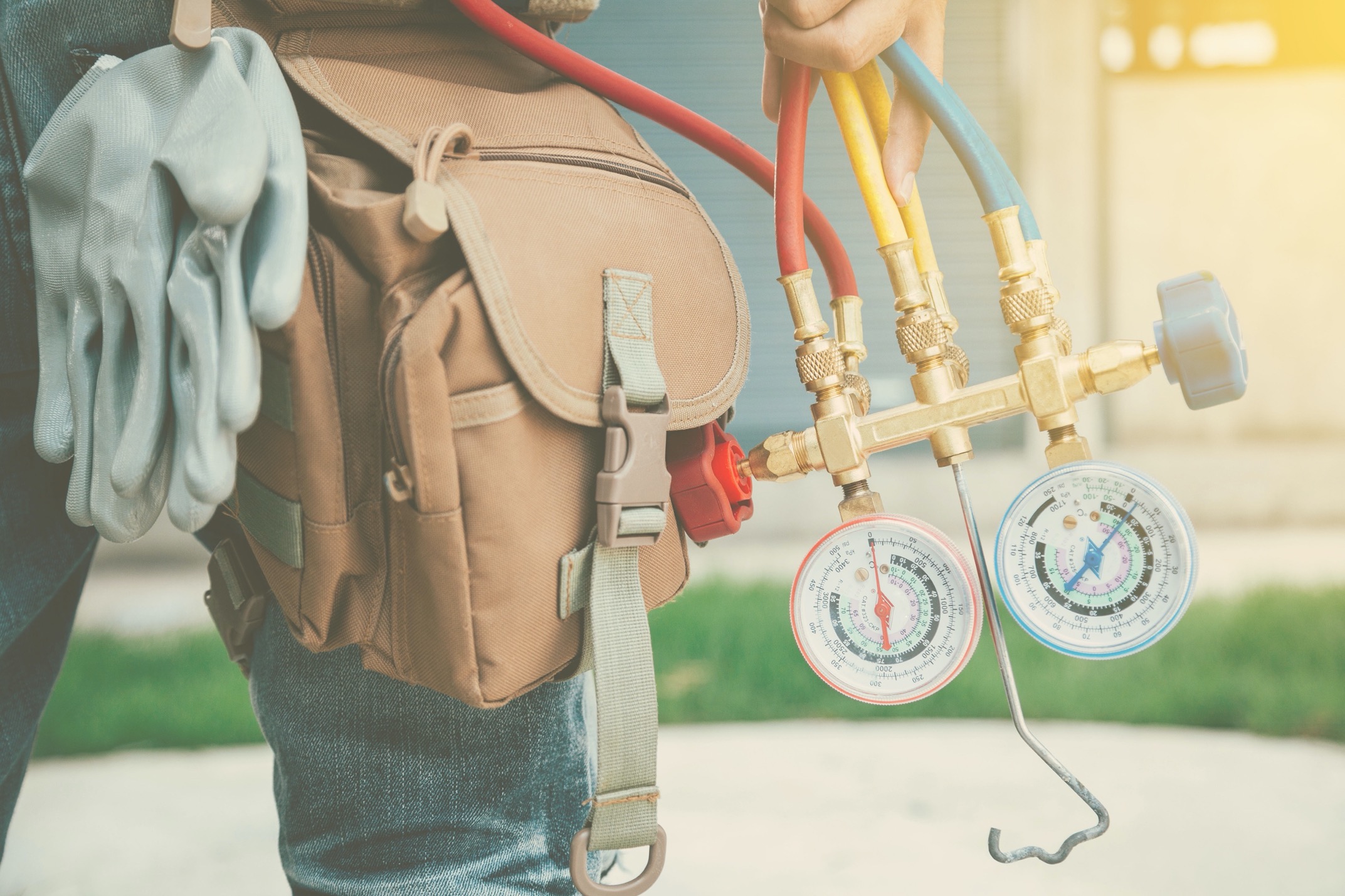 HVAC Worker holding gauges